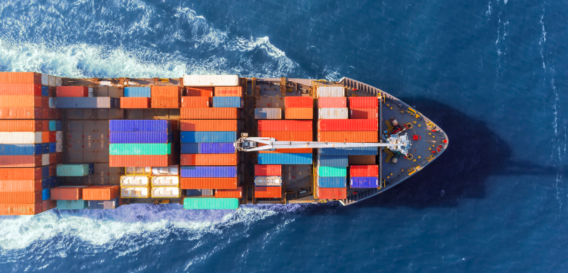 Aerial view of ship filled with shipping containers
