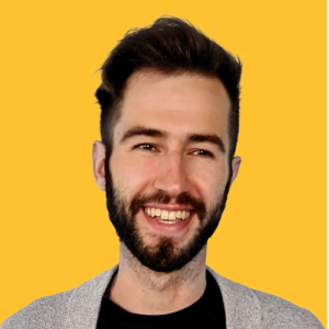 headshot of Justin Voghel with a yellow background