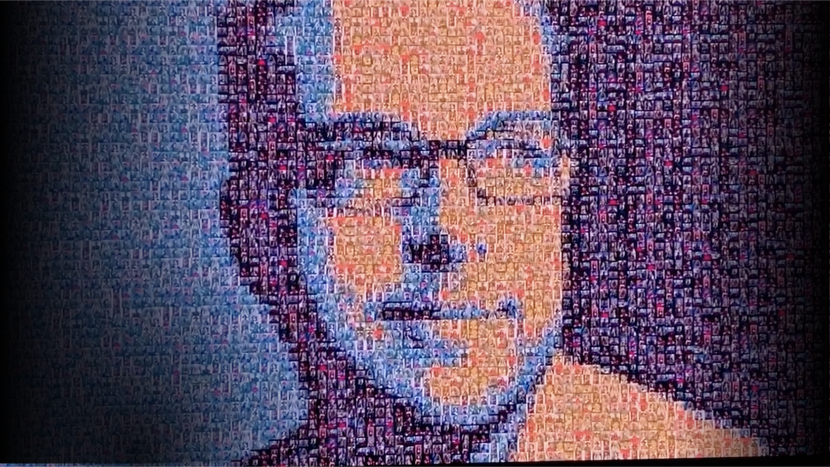 Close up of a digital wall filled with pictures that combine to make a larger composite of Dries Buytaert's face