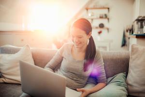 woman at laptop writing