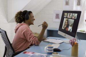 Woman in home office on video conference