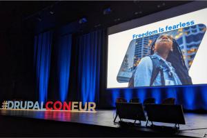 Color photo of empty stage at DrupalCon Lille