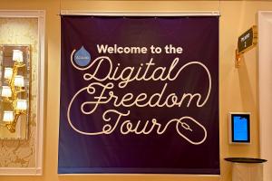 Color photo of Digital Freedom Tour banner at Engage Boston 2023