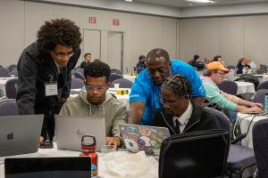 Attendees and an instructor working together during the Drupal Dev Days at DrupalCon Chicago 2026