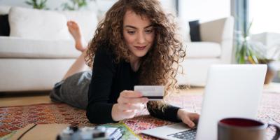 woman shopping online with credit card