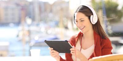 woman watching tv on tablet
