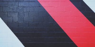 blue and red painted arrows on wall