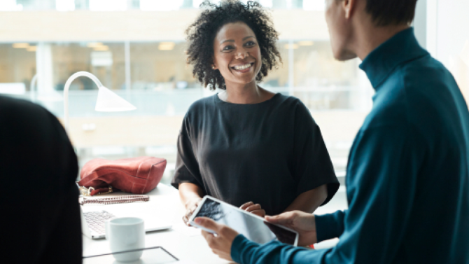 image of 2 people talking