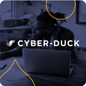 image of a person on a computer with a navy overlay and the cyber+duck logo on top