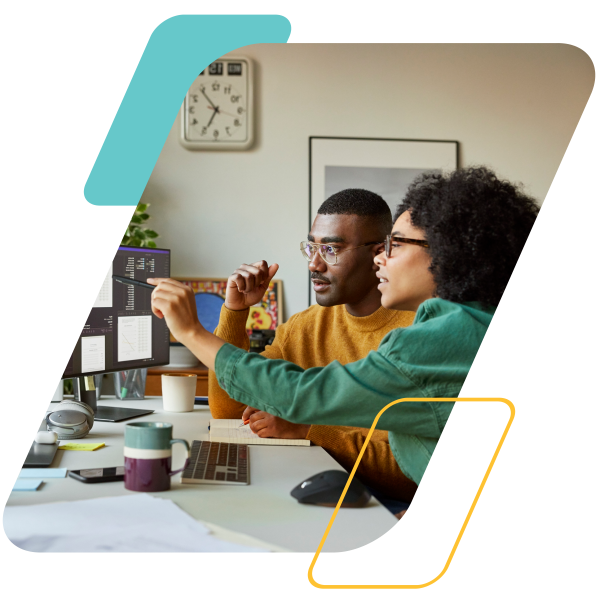 yellow and teal parallelograms  with an image of a woman sitting next to a man pointing at a computer