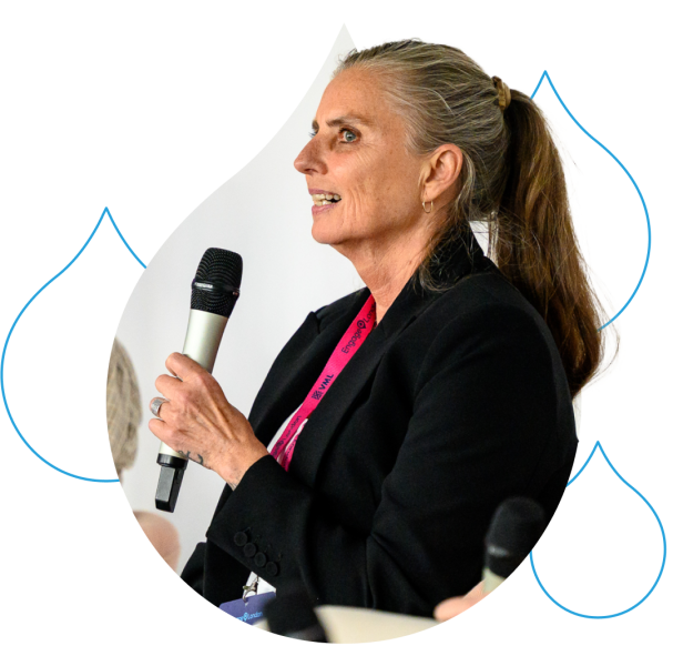 Female presenter holding a microphone