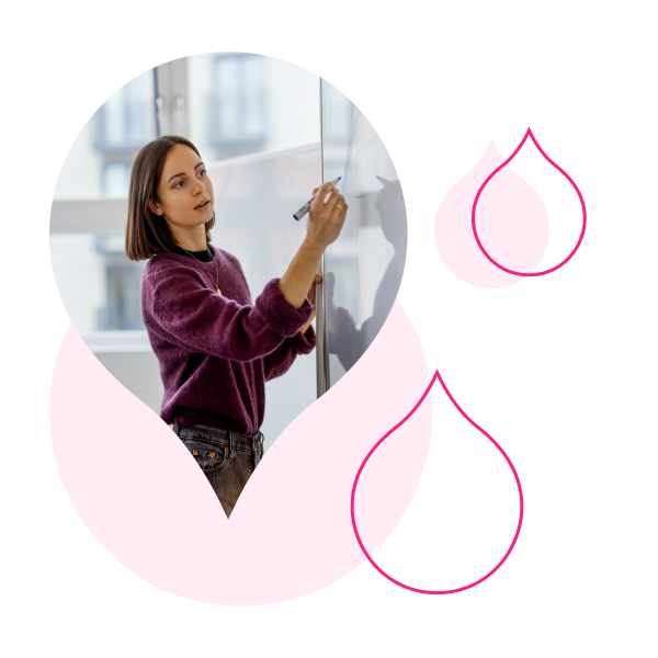 various pink droplets with an image of someone writing on a white board