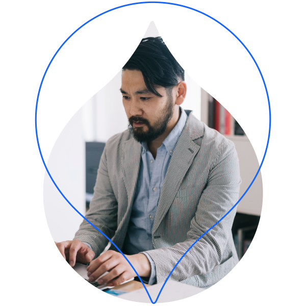 person on a computer masked by a droplet
