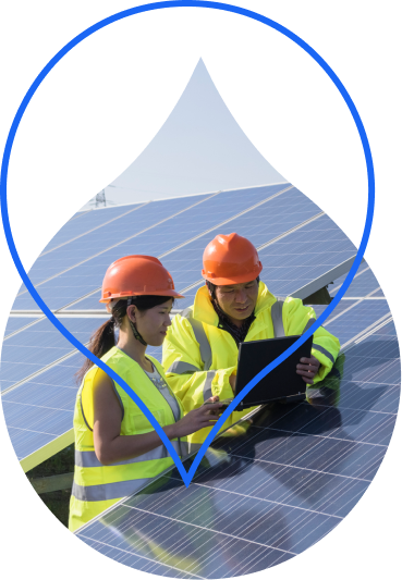 Image of 2 people working on solar panels in a cropped region of the Acquia Droplet