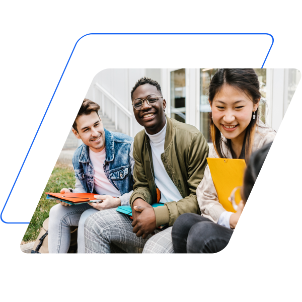 Image of 3 students all looking at the same thing masked by a parallelogram