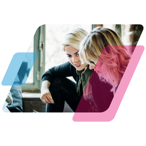 2 people looking at a screen with pink and blue parallelogram graphics around them