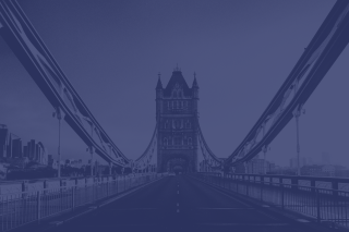 Tower Bridge in London at dusk with purple-blue tinted sky