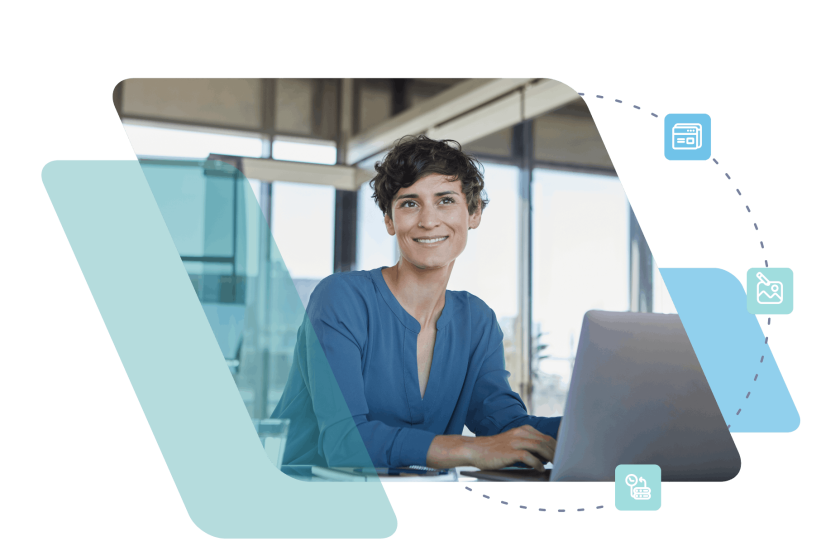 Professional woman in blue blazer sitting at desk with laptop in modern office