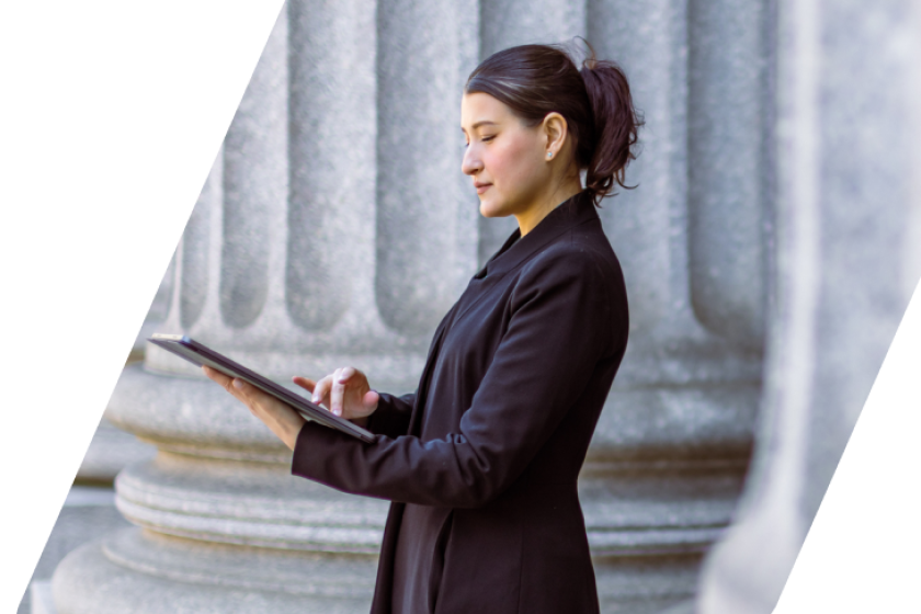 image of a person standign in front of a government building masked by a parallelogram
