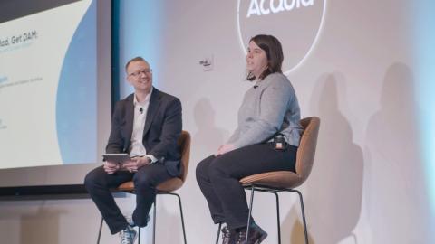 Speakers at an Acquia engage event presenting on stage