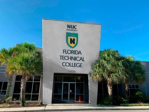 Modern glass building with "MDC Miami Dade College FLORIDA TECHNICAL COLLEGE" signage, flanked by palm trees under blue sky.