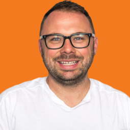 James Sims Headshot on Orange Background