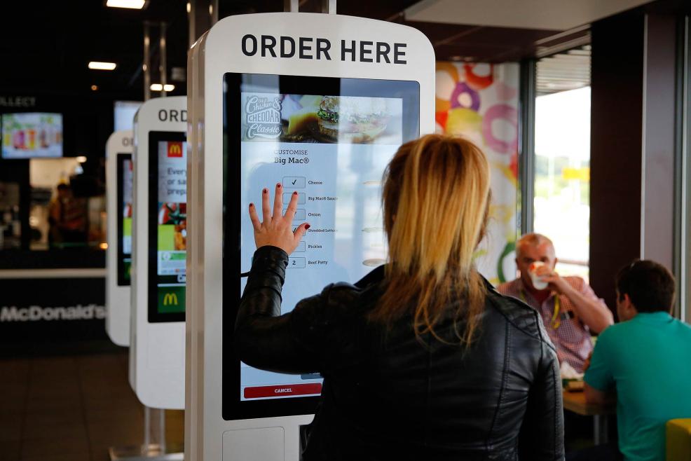 customer ordering on mcdonalds self-serve screen