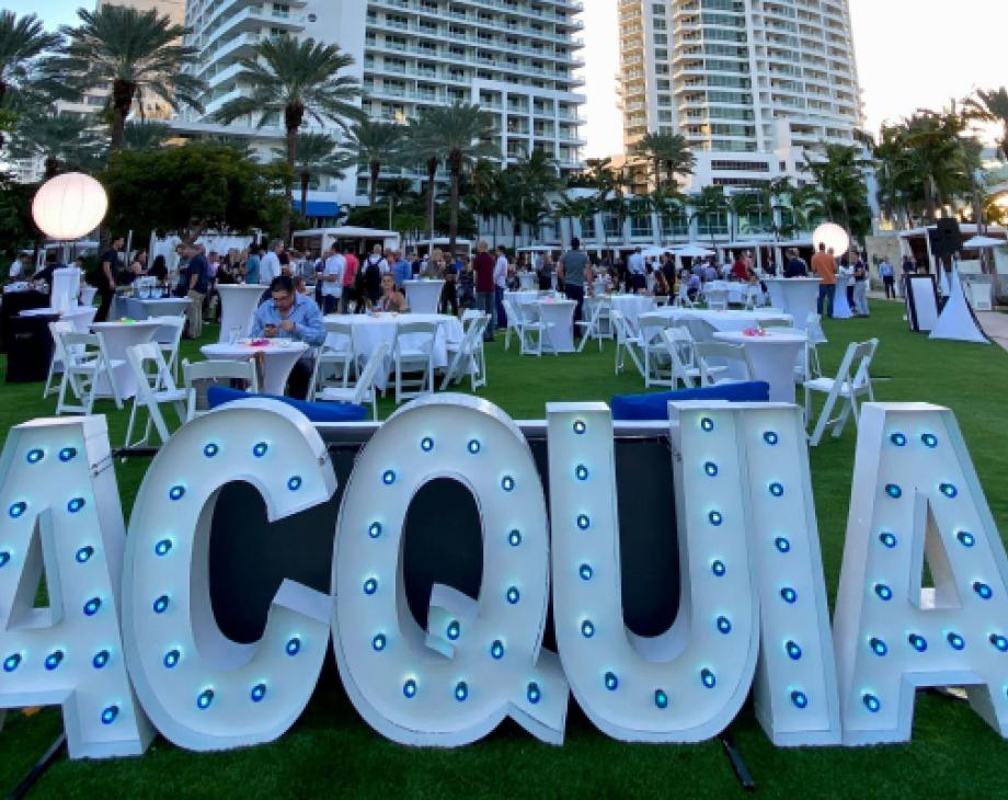 Color photo of outdoor Acquia signage at Engage Miami