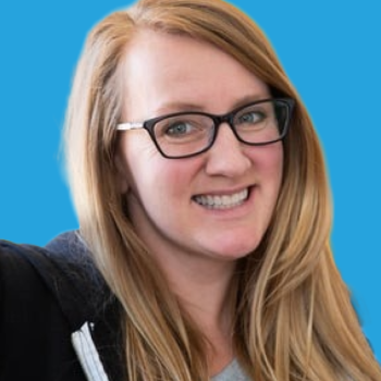 Sarah Ause Kichas Headshot Blue Backgrond