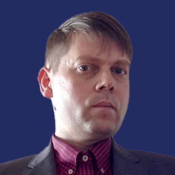 Julian Wootton Headshot on Dark Blue Background