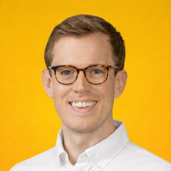 Nate Holmes Headshot Over Yellow Background