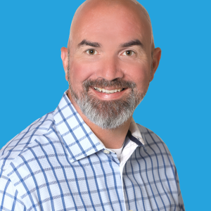 Headshot of Josh Soldo with a blue background