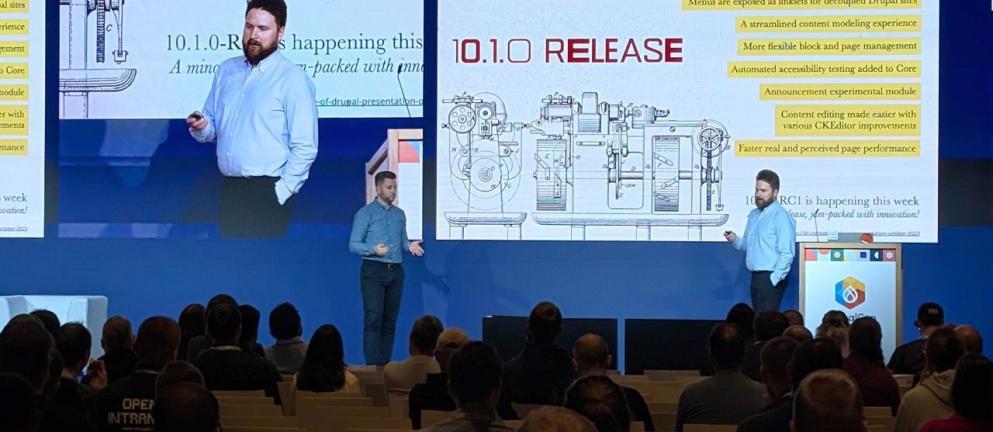 people on stage speaking to crowd